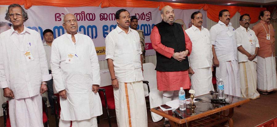 Palakkad : BJP national president Amit Shah with party leaders at a party meeting at Palakkad in Kerala on Friday. PTI Photo (PTI12_19_2014_000042B)