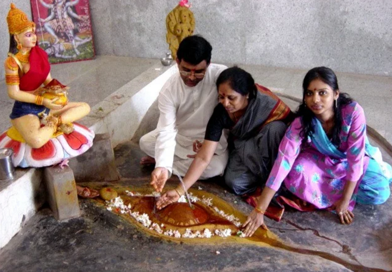 This is a picture of a family of Mother worshippers in the Kamakhya Temple at Devipuram, Andhra Pradesh..
